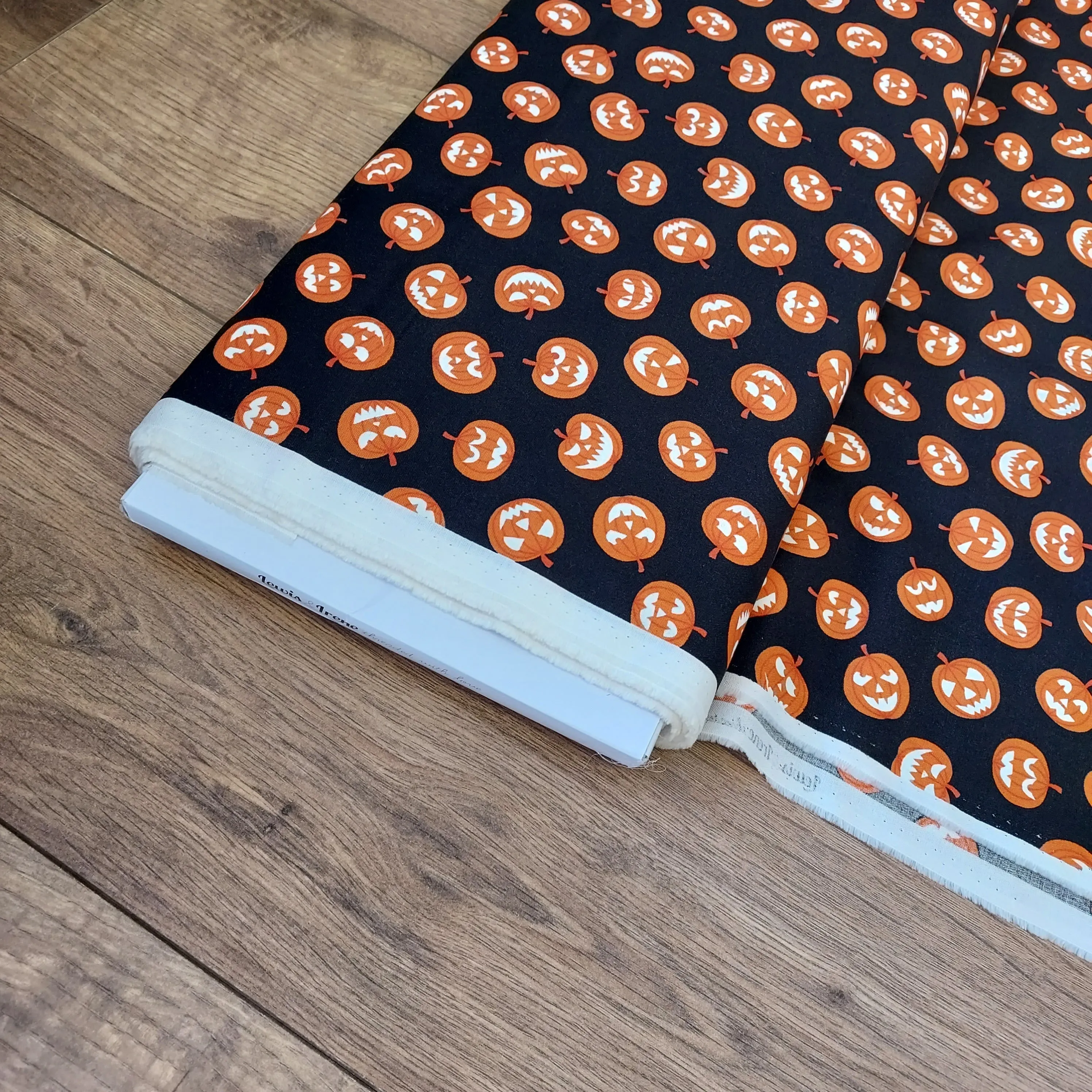 Lewis and Irene Haunted House Glow In The Dark Pumpkin Faces On Black Cotton Fabric
